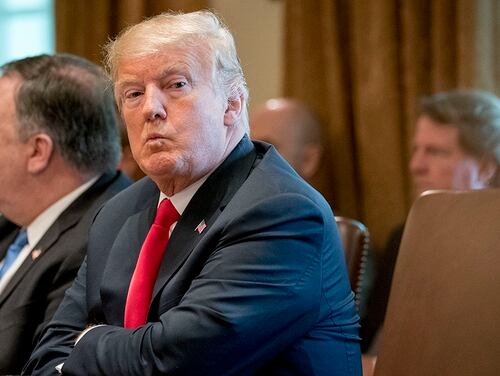 President Donald Trump, accompanied by Secretary of State Mike Pompeo, left, looks around the room during a cabinet meeting in the Cabinet Room of the White House, Thursday, Aug. 16, 2018, in Washington. (Andrew Harnik/AP)