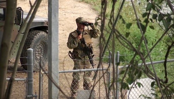 A National Guard troop watches over Rio Grande River on the border in Roma, Texas, on April 10, 2018. (John Mone/AP)