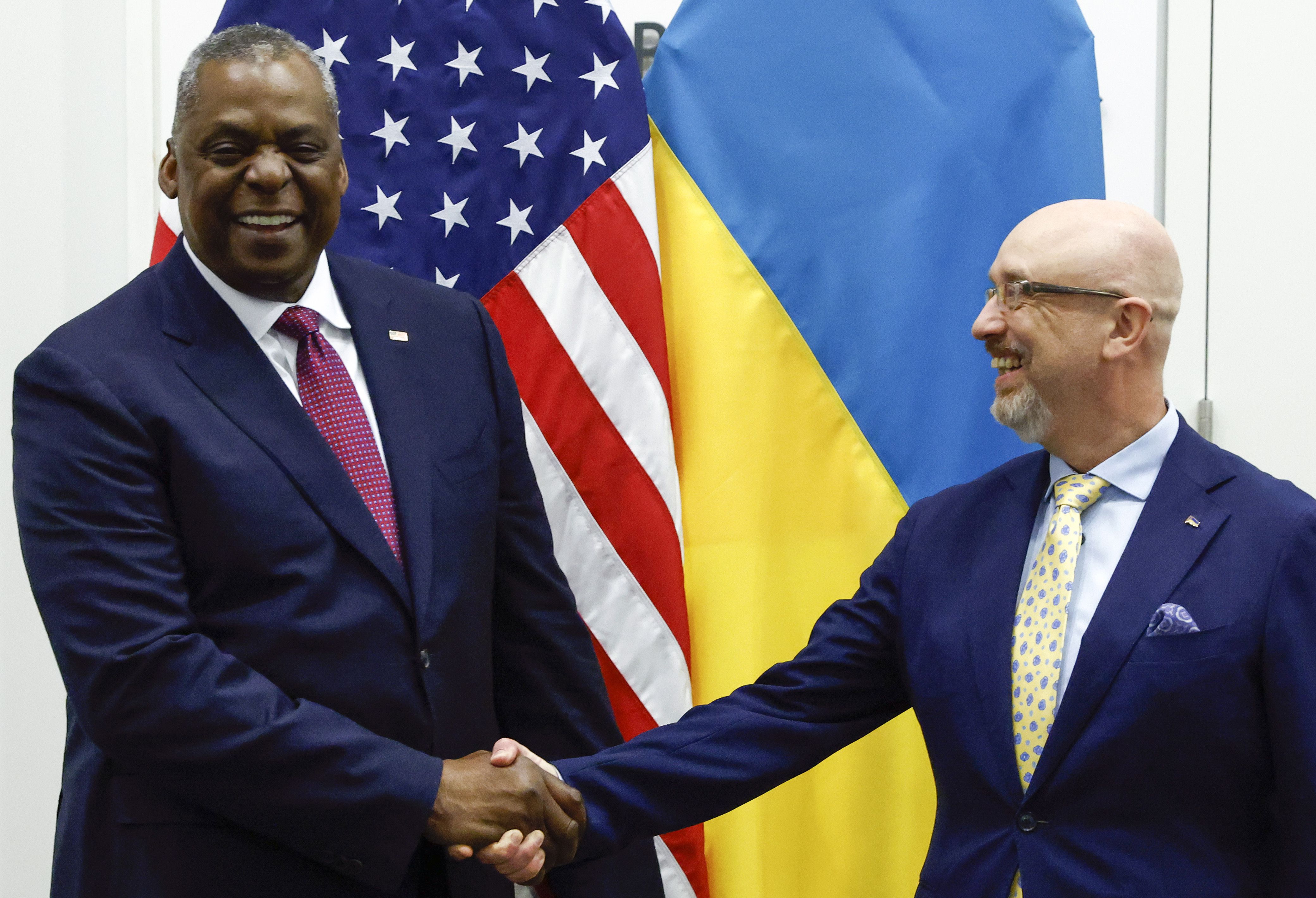 U.S. Defense Secretary Lloyd Austin, left, greets Ukraine's Defense Minister Oleksii Reznikov ahead of a NATO defence ministers' meeting at NATO headquarters in Brussels, Wednesday, June 15, 2022. NATO defense ministers, attending a two-day meeting starting Wednesday, will discuss beefing up weapons supplies to Ukraine, and Sweden and Finland's applications to join the transatlantic military alliance. (Yves Herman, Pool Photo via AP)