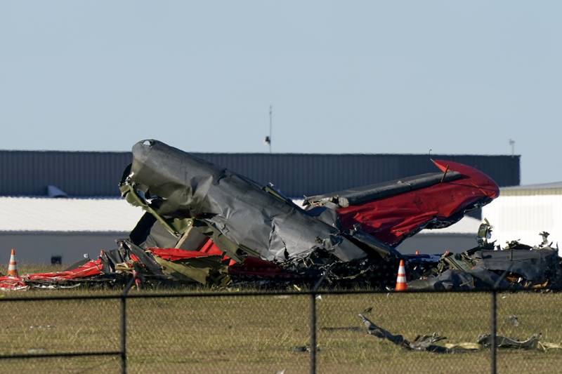 Debris from two planes that crashed during an airshow at Dallas Executive Airport are shown in Dallas on Saturday, Nov. 12, 2022.