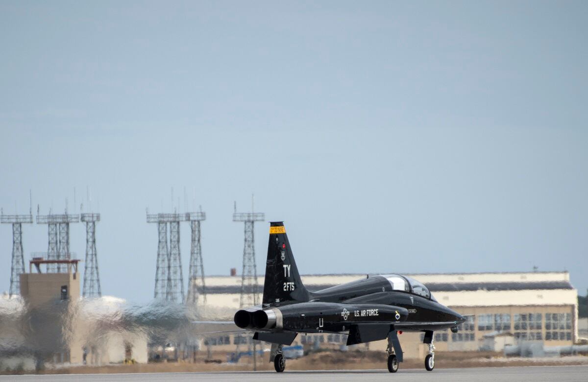 Airport Military Jet Slides Off Runway During Training