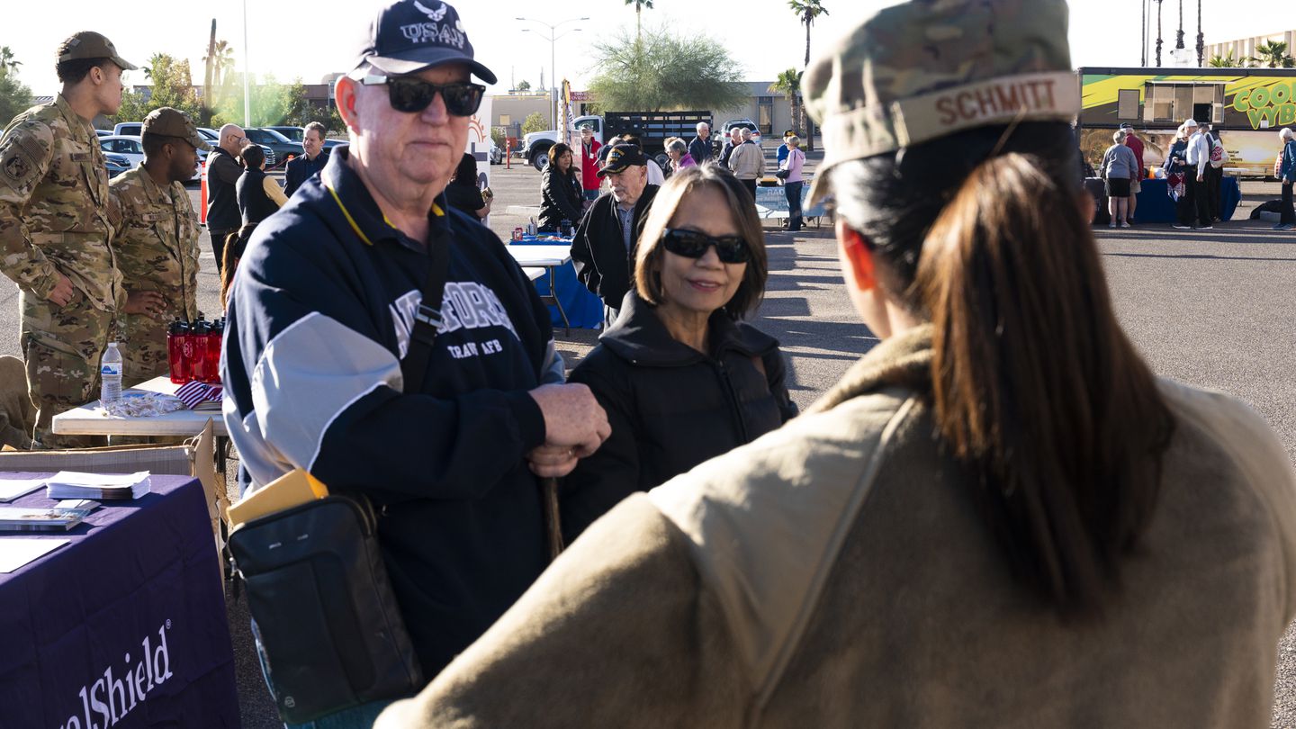 Senior Airman Alexis Schmitt speaks with veteran David Brodsky and his spouse, Rosario, during a retiree appreciation event at Luke Air Force Base, Ariz., in November 2022. (Master Sgt. Olufemi A. Owolabi/Air Force)