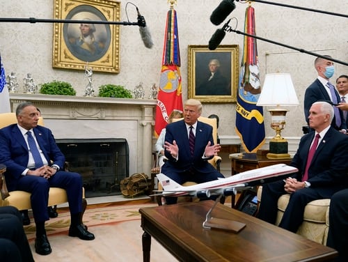 President Donald Trump meets with Iraqi Prime Minister Mustafa al-Kadhimi in the Oval Office of the White House on Aug. 20, 2020. Sitting at right is Vice President Mike Pence. (Patrick Semansky/AP)