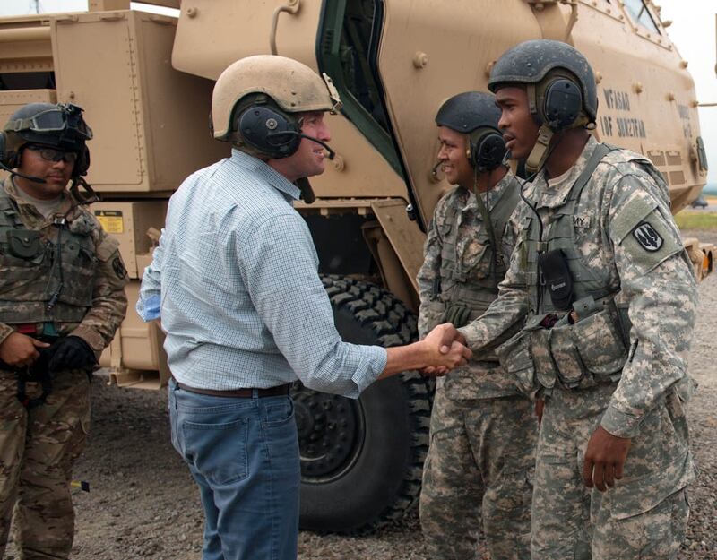 Eric K. Fanning, acting under secretary of the Army, thanks the crew of an 18th Field Artillery Brigade high mobility artillery rocket system after participating in a live-fire exercise at Fort Bragg, N.C., Aug. 11. Fanning visited the post to observe both conventional and special operations capabilities first hand and to discuss concerns of the individual soldiers and commanders. Fort Bragg is the home of the nation's premier rapid deployment ground force, capable of deploying with little to no-notice anywhere in the world in 18 hours. (U.S. Army Photo by Staff Sgt. Charles Crail/released)