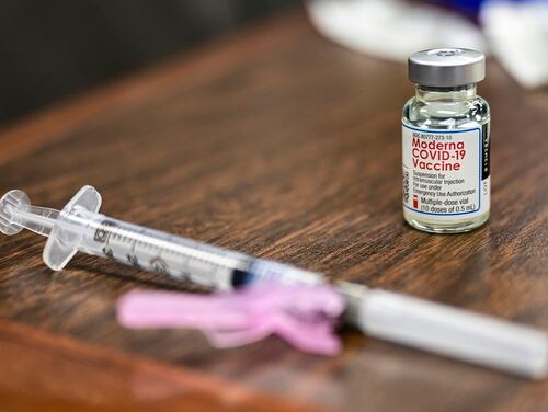 A vial of the COVID-19 vaccine and a syringe sit on a table at the Pittsburgh International Airport Air Reserve Station in Pennsylvania on Jan. 28. (Joshua J. Seybert/Air Force)