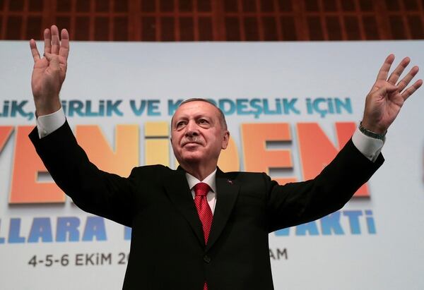 Turkey's President Recep Tayyip Erdogan, waves to supporters during an event in Ankara, Turkey, Saturday, Oct. 5, 2019. (Presidential Press Service via AP, Pool)