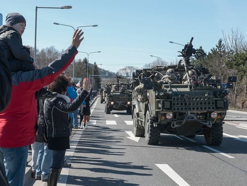 Polish citizens welcome 2nd Cavalry Regiment soldiers, along with British and Romanian troops as part of Battle Group Poland. (Sgt. 1st Class Patricia Deal/Army)