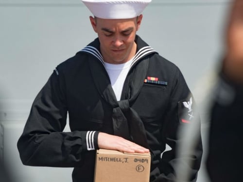 Gunner’s Mate 3rd Class Robert Ashman didn't initially realize that a burial-at-sea ceremony involving his great-grandfather would be taking place during his deployment on the destroyer Winston S. Churchill. (MC3 Evan Thompson/Navy)