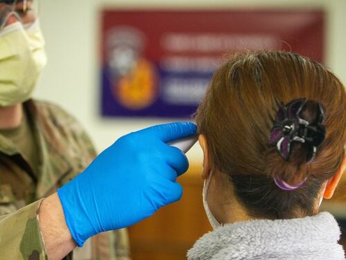 Soldiers stationed on U.S. Army Garrison Casey conduct pre-screening processes on individuals awaiting entry to the base, USAG-Casey, Dongducheon, Republic of Korea, Feb. 26, 2020. (Sgt. Amber I. Smith/Army)