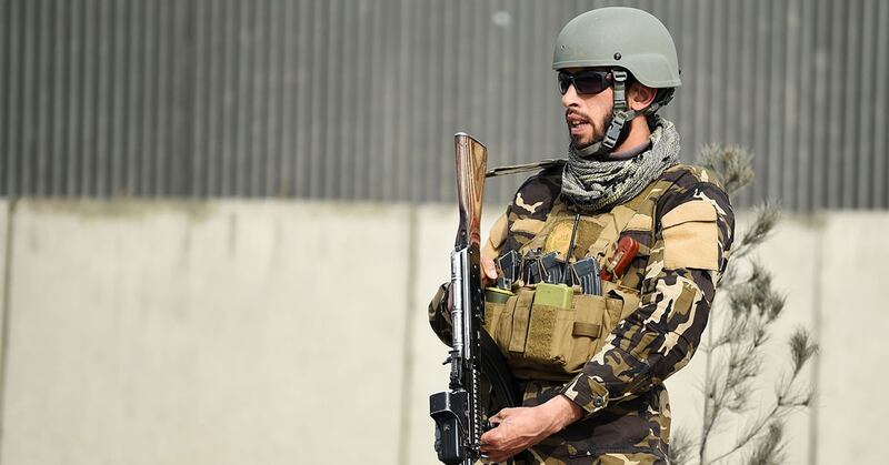 An Afghan security members stands guards near the site of car bomb attack targeting a foreign forces, in Kabul on March 2, 2018. (Wakil Kohsar/AFP/Getty Images)