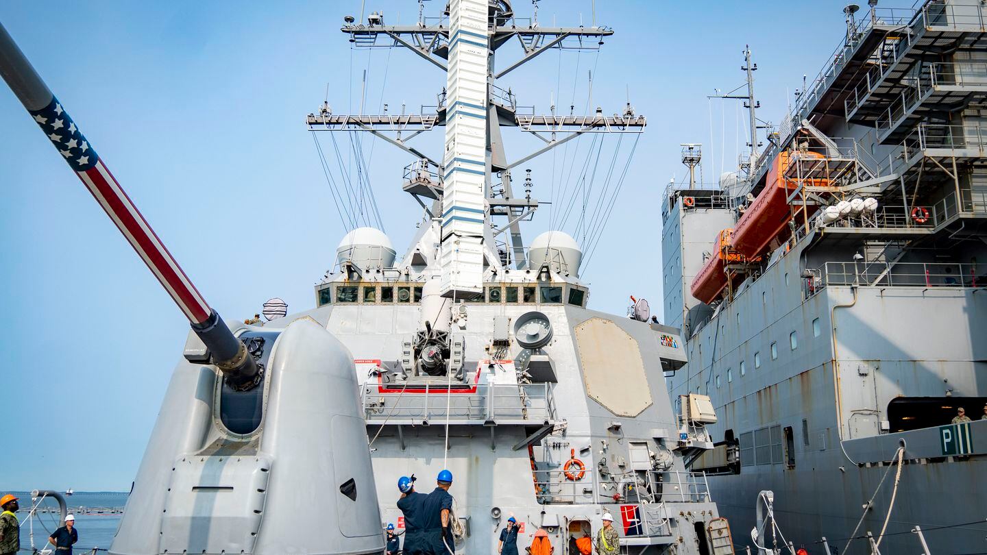 Sailors onboard the Arleigh Burke-class guided-missile destroyer USS Porter conduct a VLS Rearm event alongside Military Sealift Command dry cargo ship USNS William Mclean during Large-Scale Exercise 2023 on Aug. 3, 2023. (Interior Communications Electrician 3rd Class Hailey Servedio/US Navy)