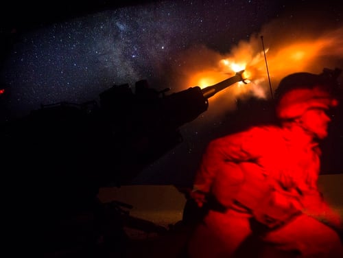 A U.S. Marine fires an M777-A2 Howitzer in the early morning in Syria, June 3. (U.S. Marine Corps photo by Sgt. Matthew Callahan)