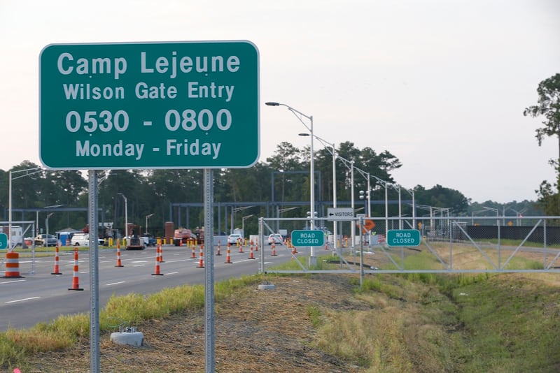 In this July 31, 2014, file photo, traffic moves onto Camp Lejeune in Jacksonville, North Carolina, as access to via the now open Wilson Gate goes into effect. (John Althouse/The Daily News via AP)