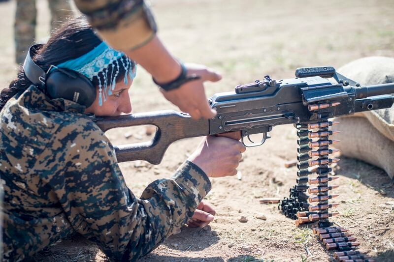 A Manbij Military Council trainee fires a 7.62mm PK machine gun during marksmanship training in February 2017, at Sanaa Training Center in northwest Syria. (Army)