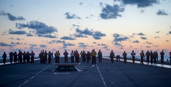 Sailors search for foreign object debris on the flight deck aboard the aircraft carrier George H.W. Bush on Dec. 4 while the flattop was underway in the Atlantic Ocean. (Mass Communication Specialist Seaman Apprentice Sophie Pinkham/Navy)