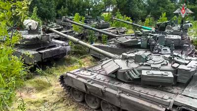 In this photo released by Russian Defense Ministry Press Service on Wednesday, July 12, 2023, Tanks belonging to Russia's Wagner military contractor are parked ahead of their handover to the Russian military at an undisclosed location.