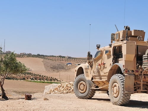 U.S. personnel provide security during an independent patrol outside Manbij, Syria, Aug. 11, 2018. These independent, coordinated patrols are conducted with Turkish military forces who stay on the opposite side of the demarcation line. (Sgt. Nicole Paese/Army)