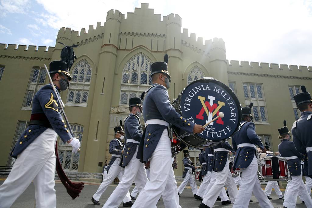 Virginia Military cadets leave the barracks while participating in the annual end of the year parade on Friday, May 14, 2021, in Lexington, Va.