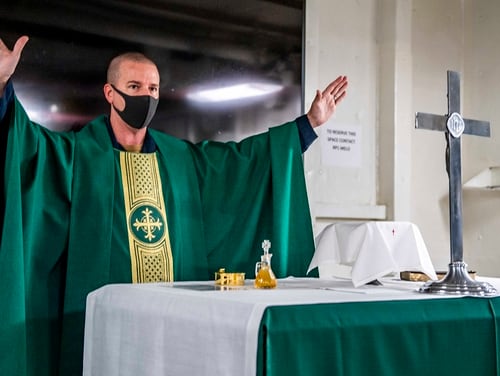 Lt. Cmdr. Jason Sluder, command chaplain aboard the USS Germantown, leads a worship service Sunday as the dock landing ship operates in the Philippine Sea. (MC2 Taylor DiMartino/Navy)