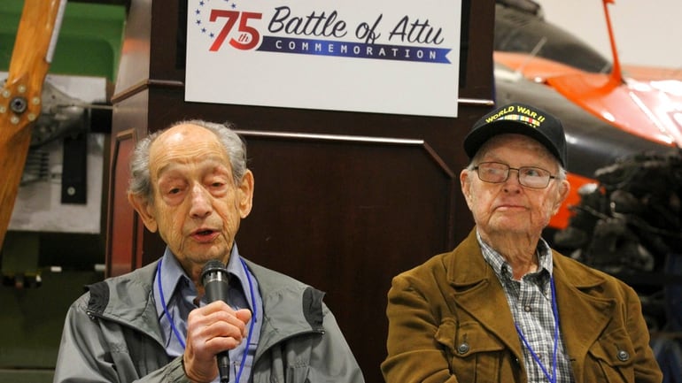 In this May 19, 2018, photo World War II veterans Allan Seroll, left, of Massachusetts, and William Roy Dover, right, of Alabama, right, attend a 75th anniversary celebration of the Battle of Attu in Anchorage, Alaska. Dover was an American soldier who took part in the May 1943 effort to reclaim Alaska's Attu Island from the Japanese. It was the only World War II battle fought on North American soil. (Mark Thiessen/AP)
