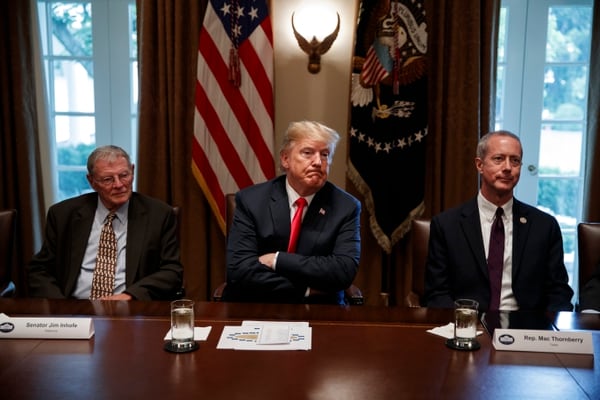 President Donald Trump (center) meets with Senate Armed Services Committee Chairman Jim Inhofe, R-Okla. (left), and House Armed Services Committee Chairman Mac Thornberry, R-Texas (right), at the White House on June 20, 2018.(Evan Vucci/AP)