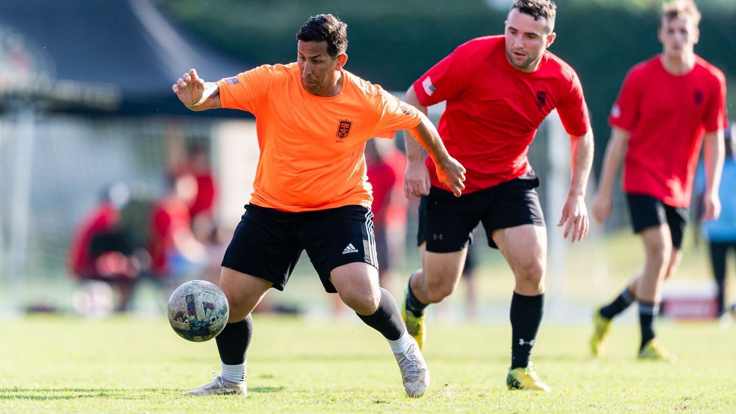 A soldier from Fort Moore, Georgia, receives a pass during the active duty bracket championship match of the 2023 Stars Stripes and Soccer Cup at Children's Healthcare of Atlanta Training Ground in Marietta, Ga., on Saturday June 3. (Mitch Martin/Atlanta United)