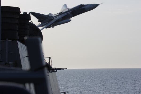 A Russian Sukhoi Su-24 attack aircraft makes a very-low altitude pass by the USS Donald Cook (DDG 75) April 12, 2016. (Navy)