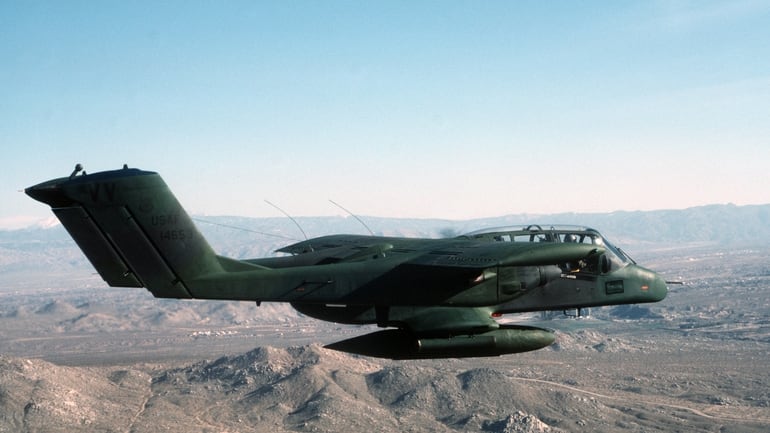 An air-to-air right side view of an OV-10 Bronco aircraft of the 27th Tactical Air Support Squadron over George Air Force Base.