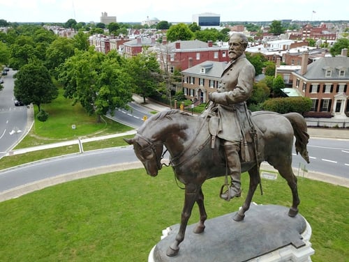 A statue of Confederate General Robert E. Lee that stands in the middle of a traffic circle on Monument Avenue in Richmond, Va, in 2017. (AP Photo/Steve Helber)