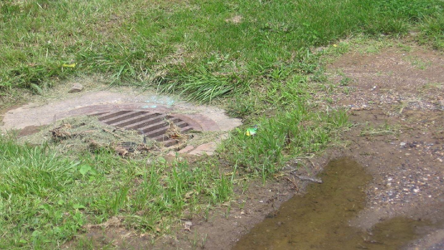 This open stormwater inlet was near where an estimated 2,000 to 3,000 gallons of unsterilized lab wastewater sprayed from an outdoor storage tank at Fort Detrick. The inlet sends water into Carroll Creek, a popular waterway that flows through downtown Frederick, Maryland. (Maryland Department of the Environment)