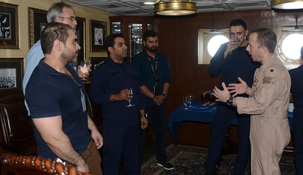 Cmdr. Andrew Shulman, commanding officer of Strike Fighter Squadron (VFA) 146, right, thanks first reponders from the Bahrain International Airport Rescue and Firefighting Service during a visit aboard the aircraft carrier Nimitz on Sept. 13, 2017, in the Arabian Gulf. (Mass Communication Specialist 2nd Class Holly L. Herline/Navy)