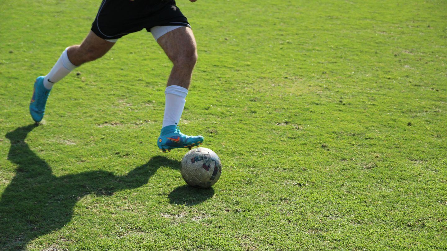 An airman assigned to Robins Air Force Base, Georgia, dribbles the ball during the 2023 Stars Stripes and Soccer Cup at Atlanta United FC's training facility in Marietta, Georgia. (Davis Winkie/Staff)