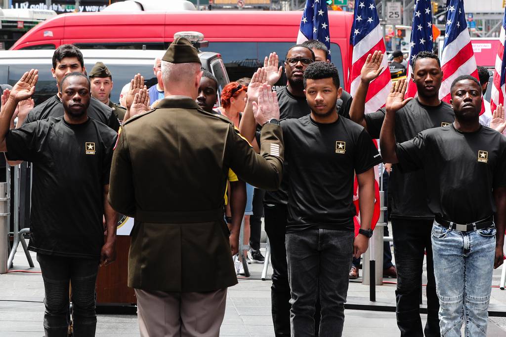 Brig. Gen. John M. Cushing, deputy commanding general of United States Army Recruiting Command, administers the oath of enlistment to a formation of future Soldiers during a U.S. Army Birthday ceremony in Times Square, N.Y., on June 14, 2022.