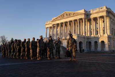 Members of the National Guard gather outside the U.S. Capitol on Jan. 12, 2021, in Washington.