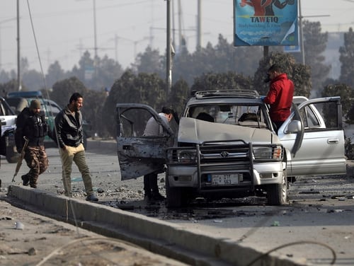 Security personnel inspect the site of a bomb attack in Kabul, Afghanistan, Tuesday, Feb. 2, 2021. (Rahmat Gul/AP)