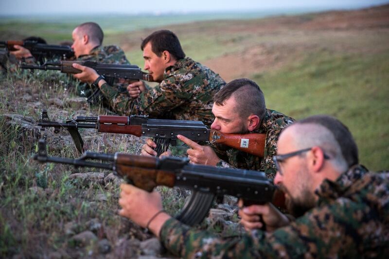 Foreign fighters who joined the Kurdish People's Protection Units (YPG) to fight in their ranks against jihadists and Islamist rebels in northeastern Syria take part in a training session on April 29, 2015 in the south-west Syrian region of Ras al-Ain, close to the Turkish border. AFP PHOTO / UYGAR ONDER SIMSEK (Photo credit should read UYGAR ONDER SIMSEK/AFP/Getty Images)