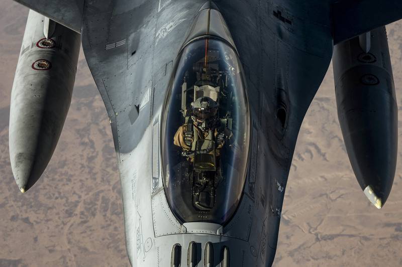 A U.S. Air Force KC-10 Extender conducts aerial refueling with an F-16 Fighting Falcon in the U.S. Central Command area of responsibility Nov. 30, 2020.