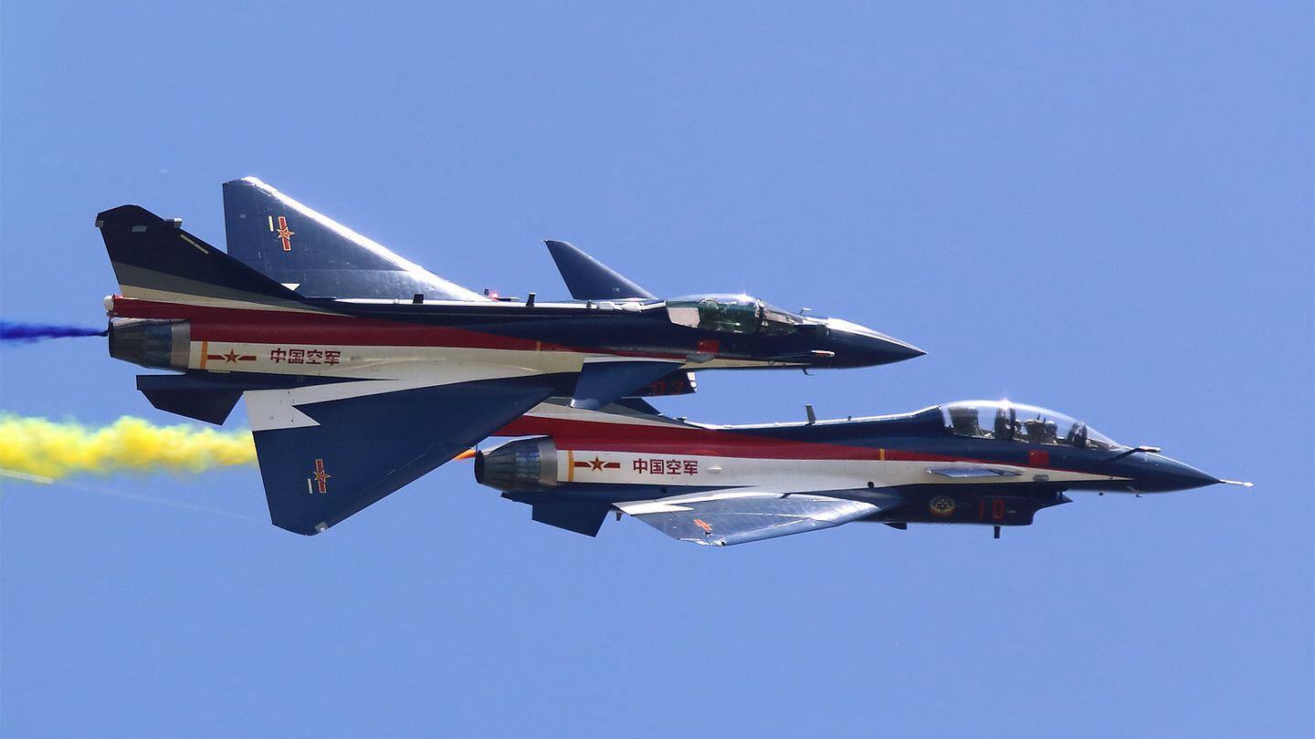 LIMA 2023 saw the debut of the Chengdu J-10CY single-seat aerobatics aircraft of China's August 1st demonstration team. Here, a J-10CY banks alongside a twin-seat J-10SY. (Mike Yeo/Staff)