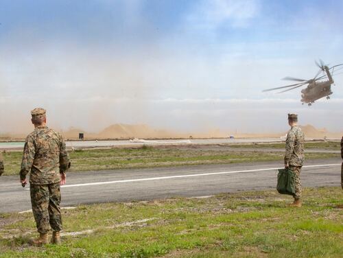 Leaders from I Marine Expeditionary Force and 3rd Marine Aircraft Wing observe a CH-53E Super Stallion depart from the Airport in the Sky on Cataline island, California, March 1. (Lance Cpl. Juan Anaya/Marine Corps)