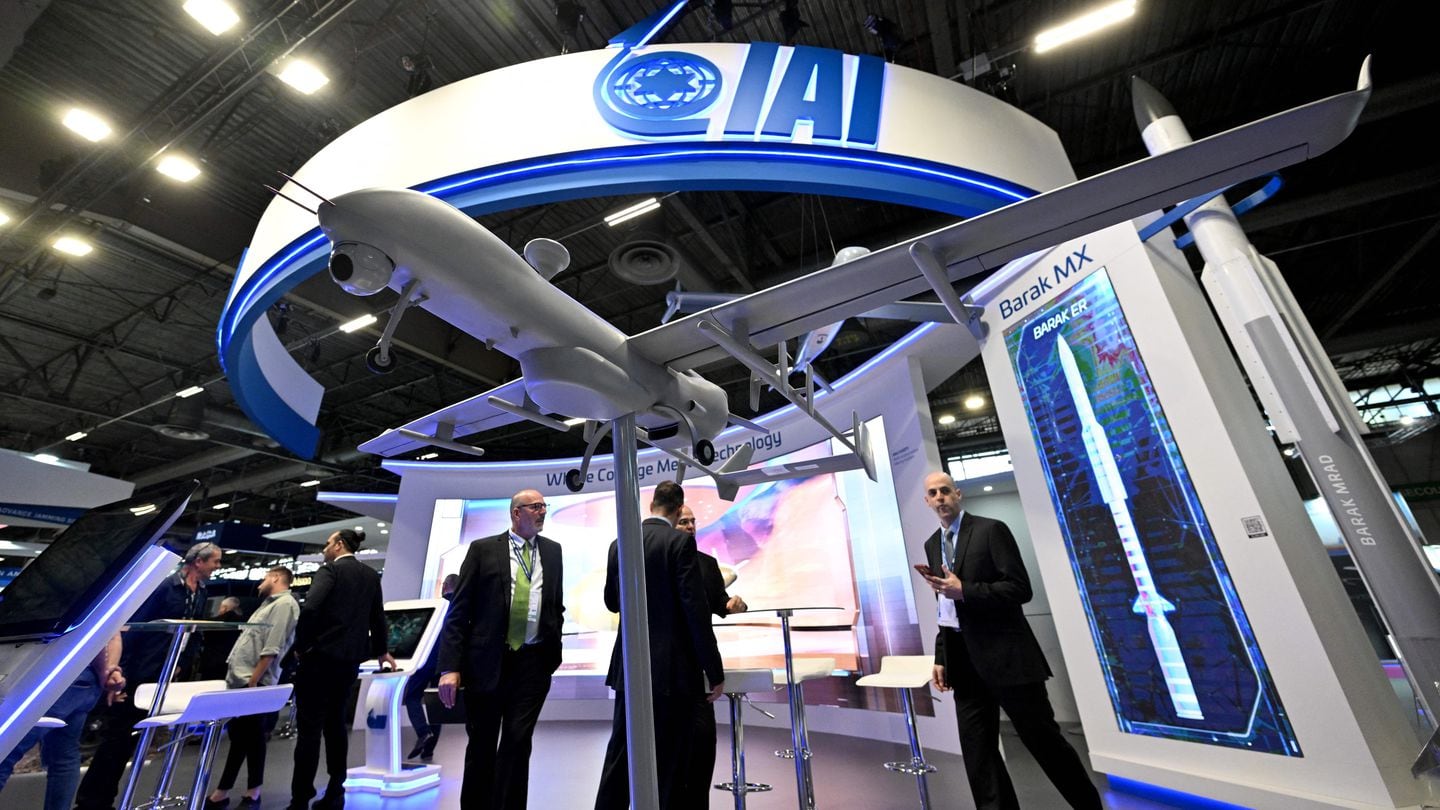 Visitors stand on the booth of the Israeli defense technology company Israel Aerospace Industries (IAI) at the Eurosatory international land and airland defence and security trade fair, in Villepinte, a northern suburb of Paris, on June 13, 2022. (Photo by Emmanuel DUNAND / AFP) (Photo by EMMANUEL DUNAND/AFP via Getty Images)