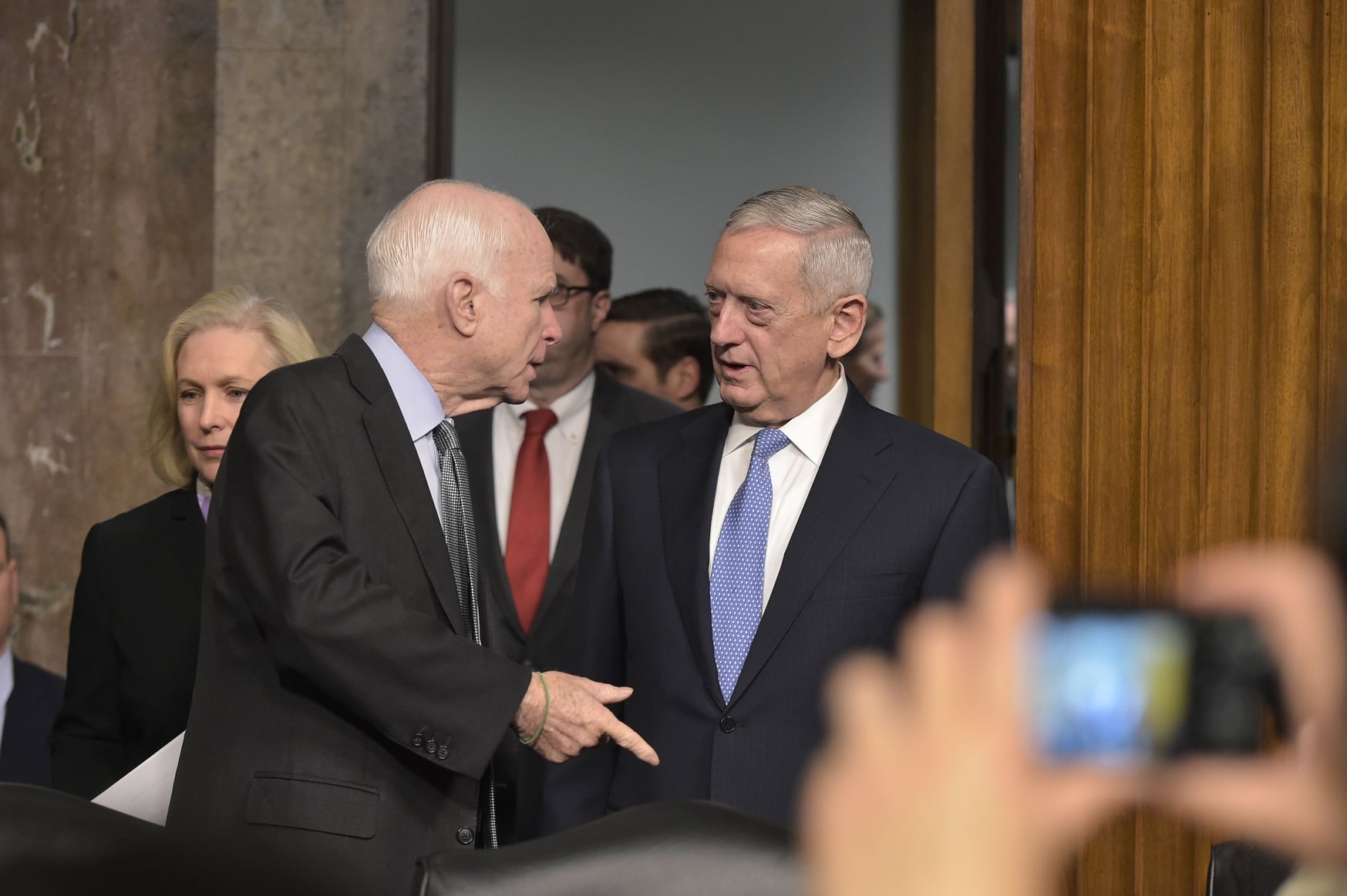 FILE- In this Jan. 12, 2017 file photo, retired Marine Corps general James Mattis speaks to Sen. John McCain (L),R-Ariz., before he testifies before the Senate Armed Services Committee. (Mandel Ngan/AFP/Getty Images)