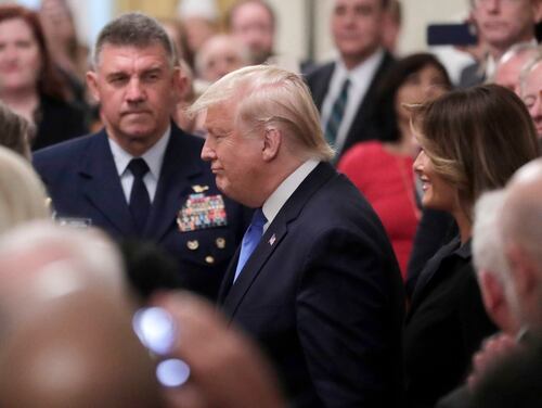 President Donald Trump (center) arrives for a National Medal of Arts and National Humanities Medal ceremony in the East Room of the White House on Nov. 21. (Steve Helber/AP)