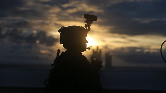 Marine Lance Cpl. Steven Rowe posts security during a visit, board, search, and seizure training as part of exercise HYDRACRAB, Santa Rita, Guam, Aug. 27, 2019. (Kelly Rodriguez/Marine Corps)