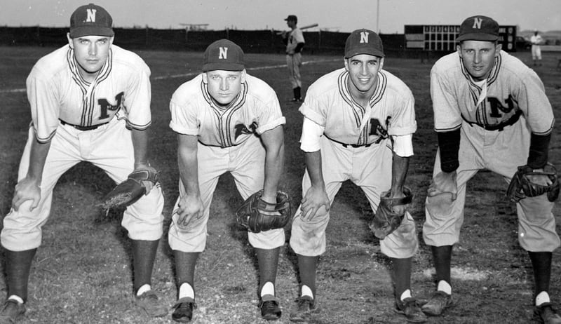 Eddie Robinson, left played first base for the Norfolk Naval Training Station’s Bluejackets for four years. His teammates included Benny McCoy, Phil Rizzuto and Jeff Cross. (Courtesy of Sargeant Memorial Collection, Norfolk Public Library)