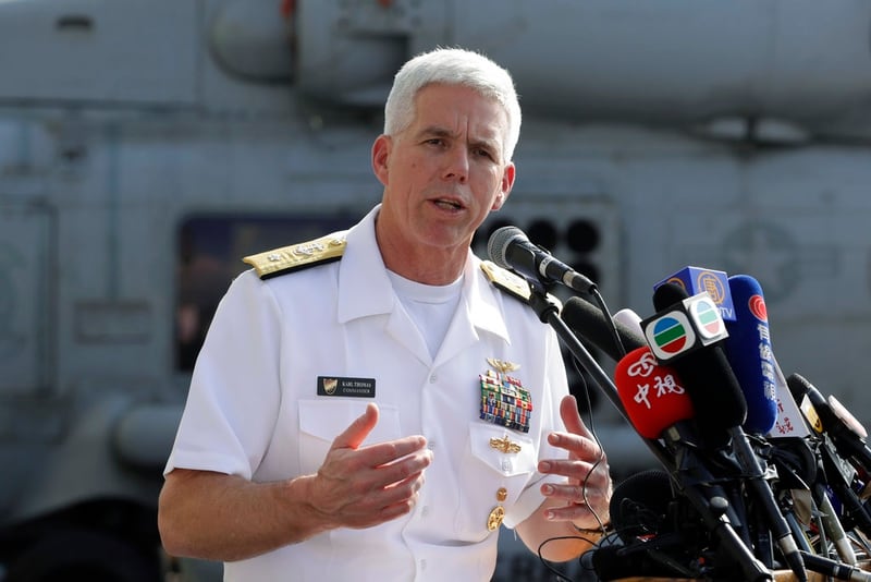 U.S. Navy Rear Adm. Karl Thomas speaks on the deck of the aircraft carrier Ronald Reagan aircraft carrier in Hong Kong on Wednesday. (Kin Cheung/AP)