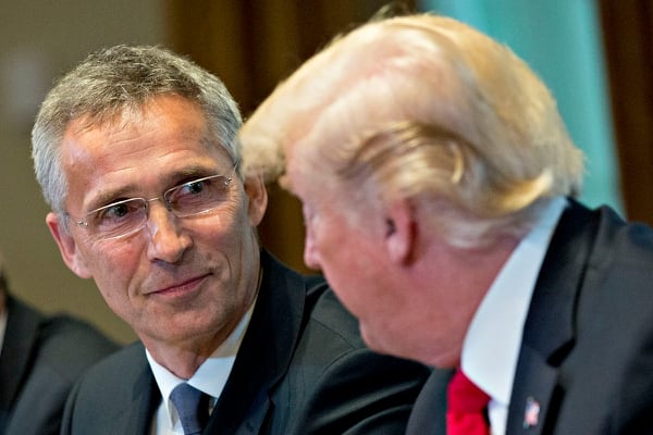 NATO Secretary General Jens Stoltenberg, left, listens as U.S. President Donald Trump, right, speaks during a meeting in the Cabinet Room of the White House in Washington on May 17, 2018. (Andrew Harrer/Bloomberg via Getty Images)