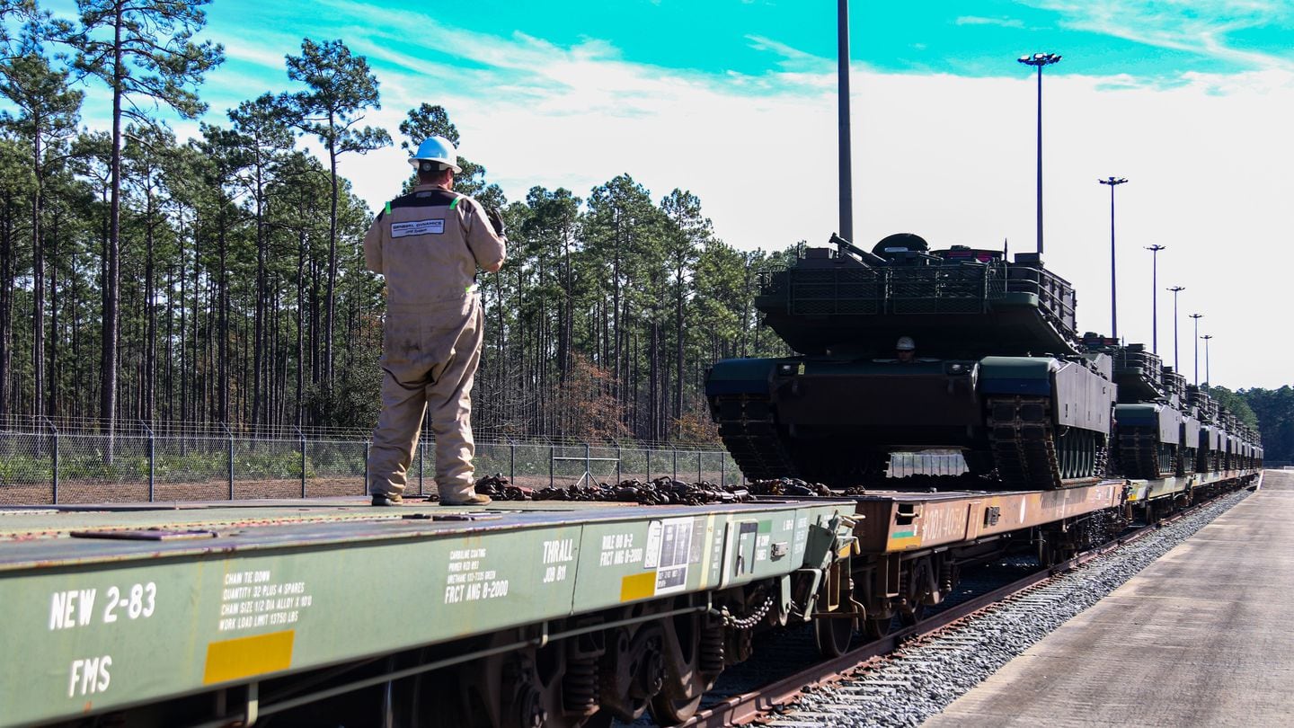 The Pentagon reported the number of U.S. contractors building tracked combat vehicles fell from three in 1990 to one in 2020. An employee of that firm, General Dynamics, guides an M1A2 tank off a train on Jan. 5, 2023. (Staff Sgt. Rakeem Carter/U.S. Army)