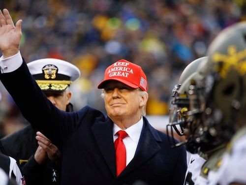 President Donald Trump waves ahead of an NCAA college football game between Army and Navy, Saturday, Dec. 14, 2019, in Philadelphia. (AP Photo/Matt Rourke)