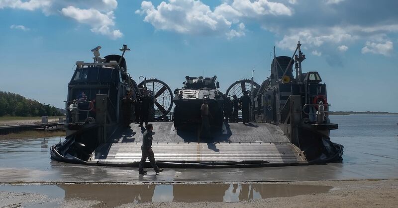 A Landing Craft Air Cushion unloads Light Armored Vehicles on Camp Lejeune, North Carolina, Oct. 4, during Type Commander Amphibious Training. (Gunnery Sgt. Robert Durham/Marine Corps)