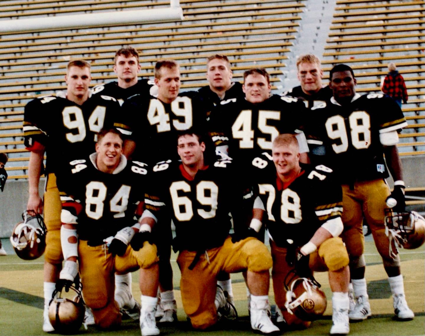 Greg Gadson wears number 98 at the far right. Gadson played outside linebacker for the U.S. Military Academy at West Point. Will Huff, #78, front row, would play an important role later on when he escorted Gadson on the flight from Baghdad to Landstuhl, Germany. Behind Gadson stands Chuck Schretzman, back row.